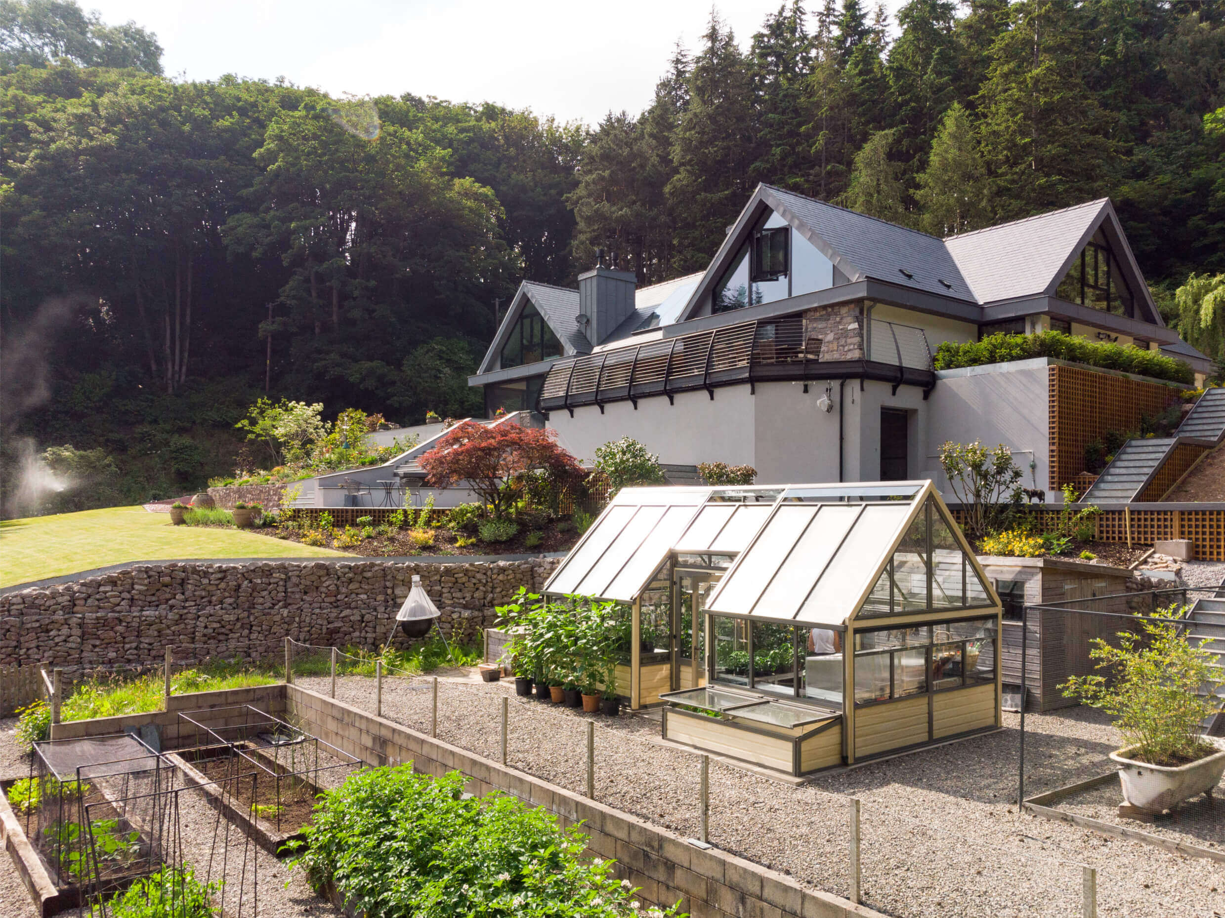 cultivar greenhouse in front of newbuild house