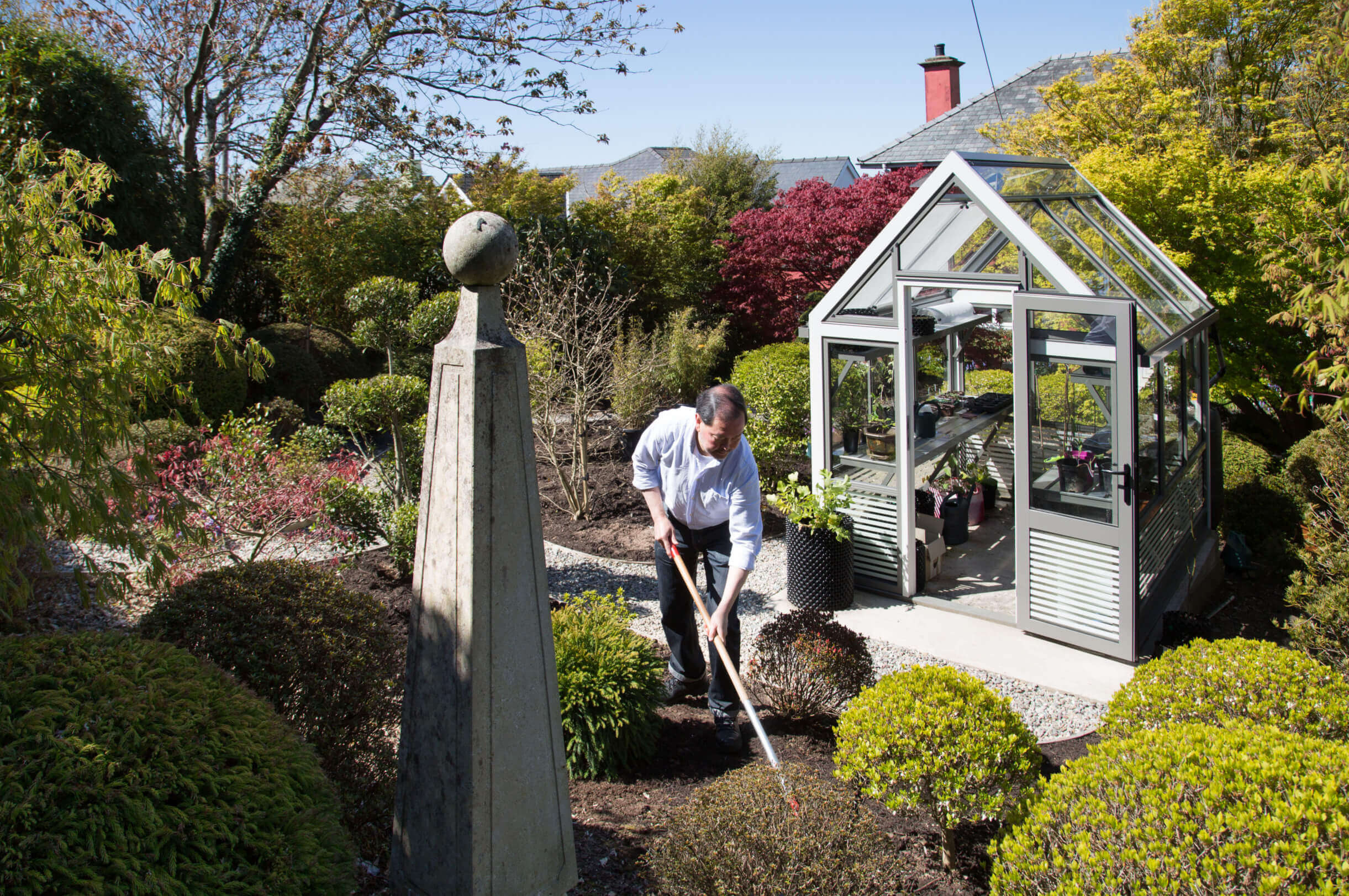 Gardening around a greenhouse