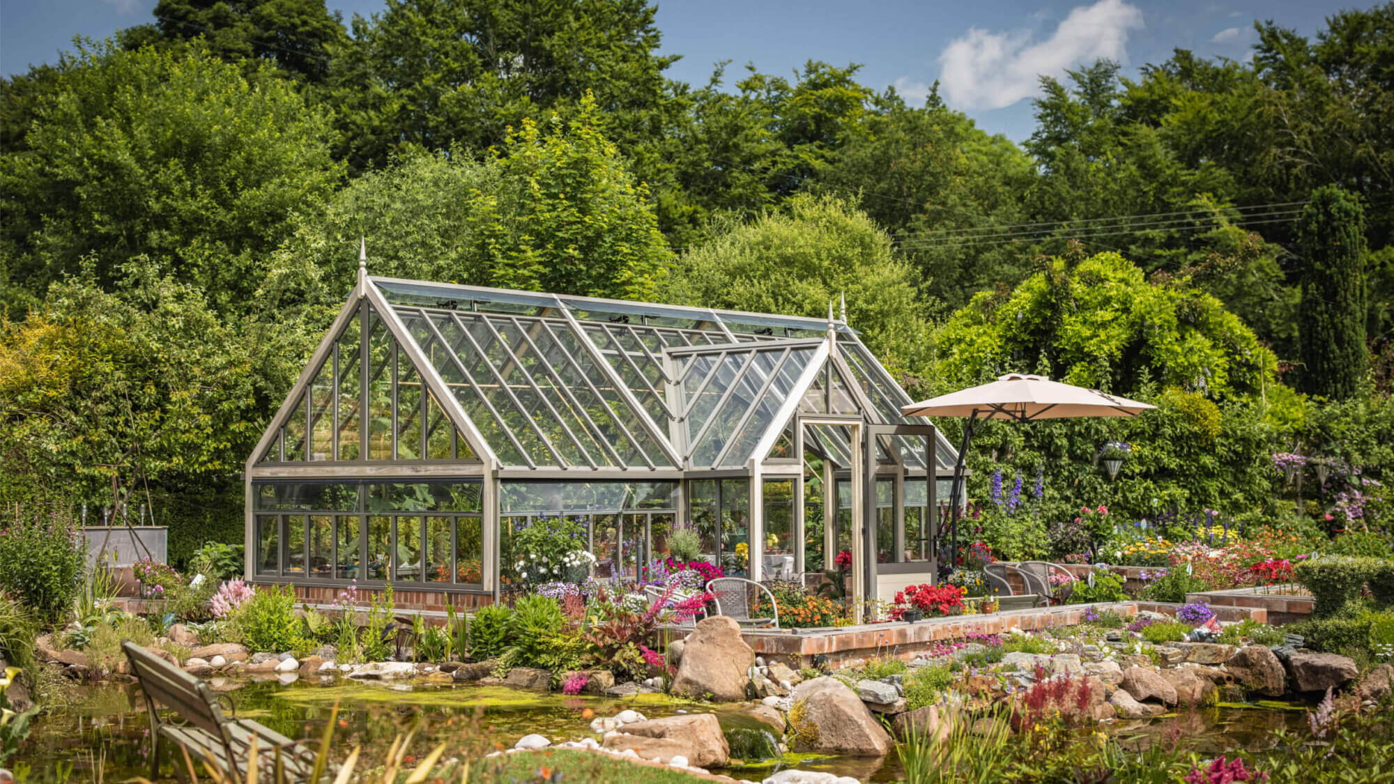 porch greenhouse on dwarf wall surrounded by plants