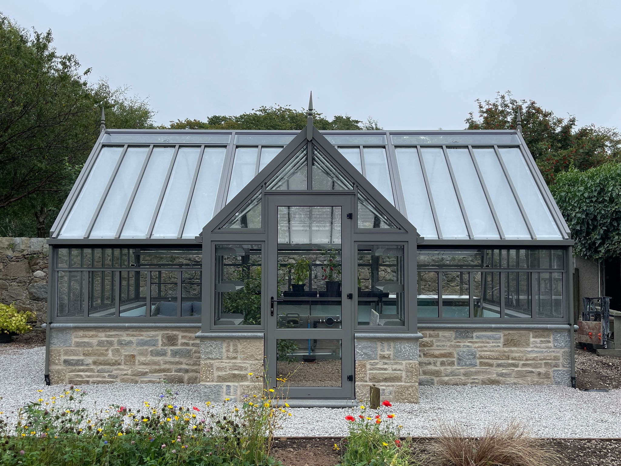 Porch greenhouse on granite dwarf wall